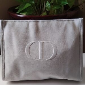 Christian Dior Cosmetic Bag Gray Canvas Pouch elegant with embossed CD logo.